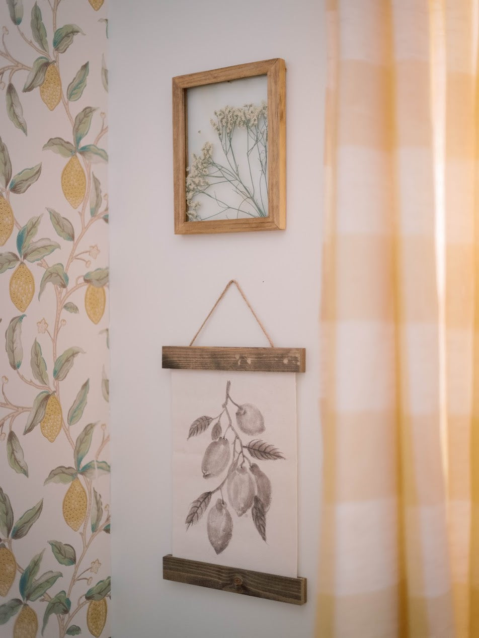 Bright and colorful yellow nursery with lemon wallpaper and plaid curtains in Lexington, South Carolina
